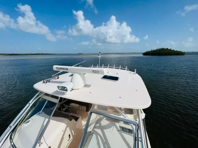 Slide: The Image of Grady-White Freedom 335 boat on calm waters, clear sky, 2014 model. - 19
