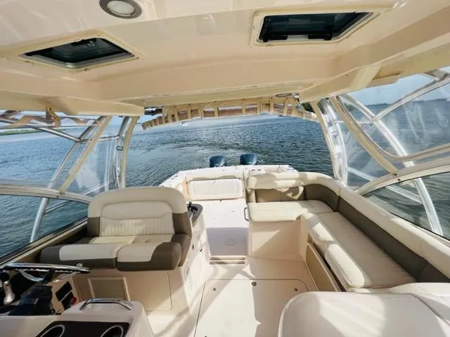 Slide: The Image of 2014 Grady-White Freedom 335 boat interior with spacious seating and ocean view. - 23