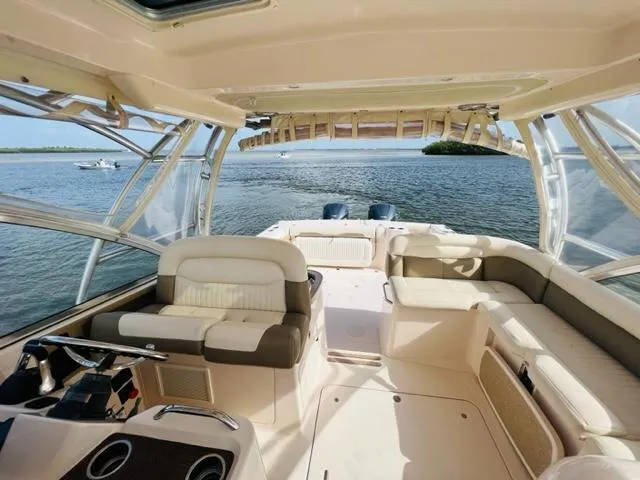 Slide: The Image of 2014 Grady-White Freedom 335 boat interior with ocean view. - 24