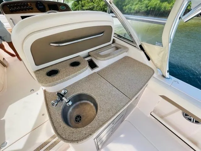 Slide: The Image of 2014 Grady-White Freedom 335 boat interior with sink and countertop. - 27