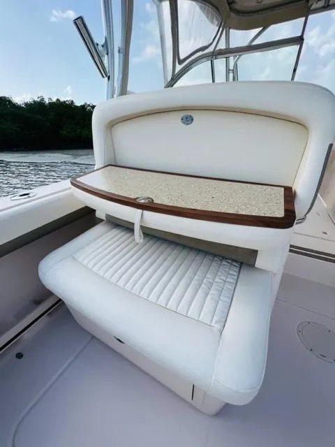Slide: The Image of 2014 Grady-White Freedom 335 boat interior seating with foldable table. - 36
