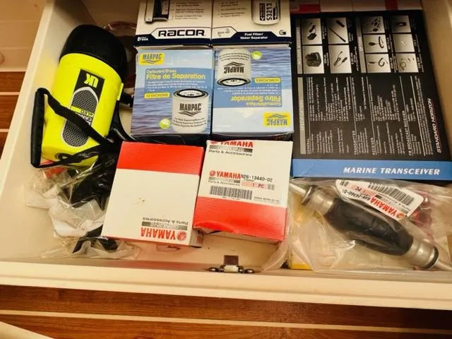 Slide: The Image of Drawer with marine equipment, Yamaha parts, filters, and a flashlight on a 2014 Grady-White Freedom 335. - 43