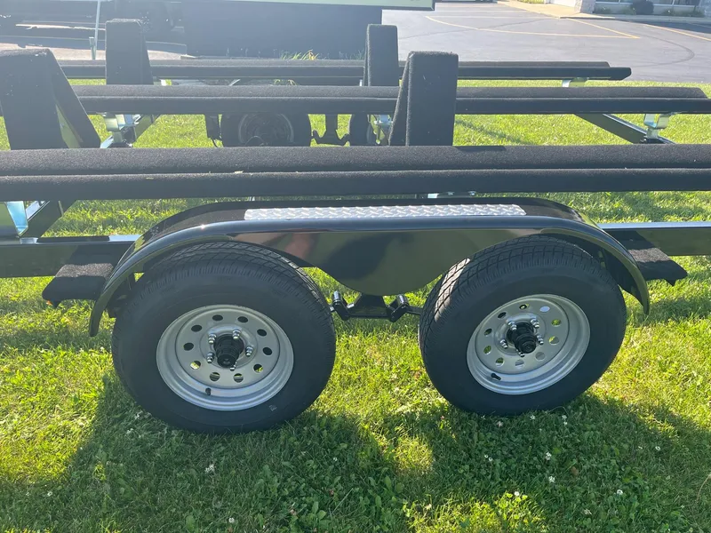 Slide: The Image of 2024 Pontoon Trailer with dual wheels on grass. - 4