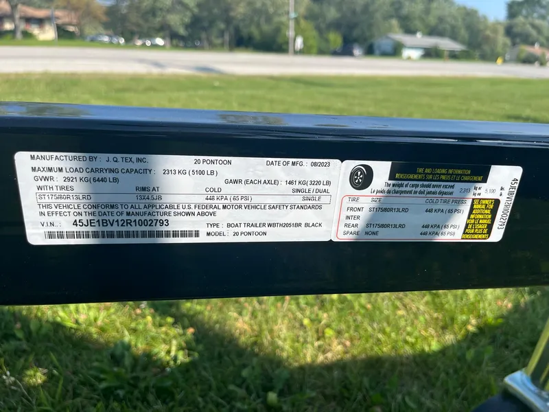 Slide: The Image of 2024 Pontoon Trailer label with specifications and safety standards. - 7