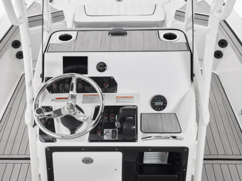 Slide: The Image of 2024 Yamaha Boats 195 FSH Sport console with steering wheel and controls. - 4