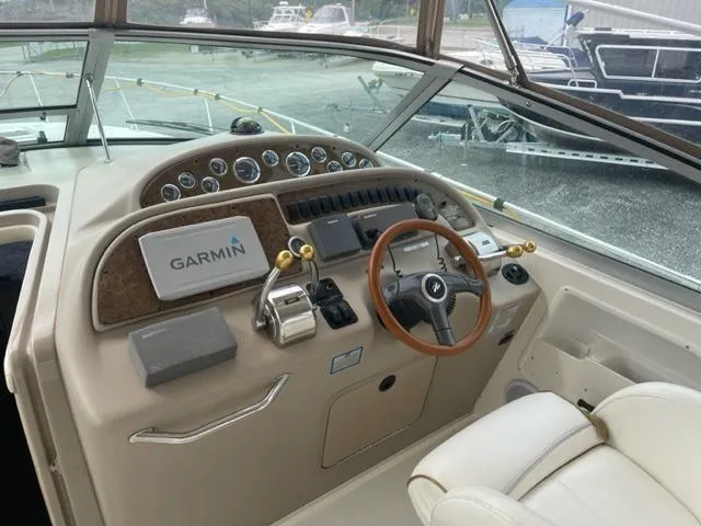 Slide: The Image of Cockpit of a 1999 Sea Ray 310 DA boat with Garmin navigation system. - 6