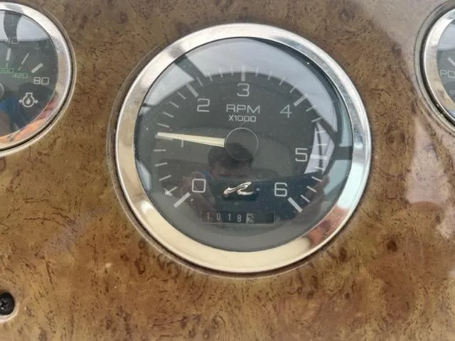 Slide: The Image of Close-up of 1999 Sea Ray 310 DA boat RPM gauge. - 7