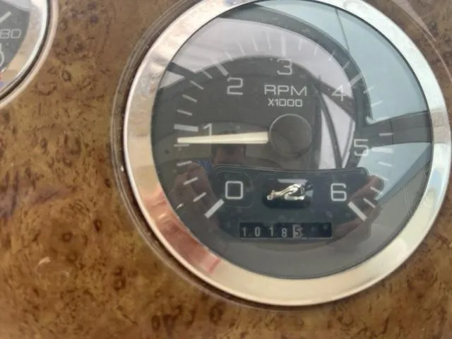 Slide: The Image of Close-up of 1999 Sea Ray 310 DA RPM gauge showing 1018.5 hours. - 8