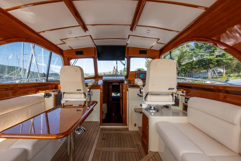 Slide: The Image of Interior of 2003 Hinckley Talaria 44 Express yacht with elegant seating and wooden finishes. - 21