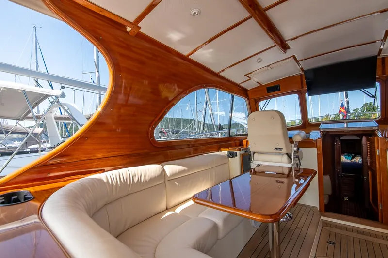 Slide: The Image of Luxurious interior of 2003 Hinckley Talaria 44 Express yacht with wooden finish and plush seating. - 22