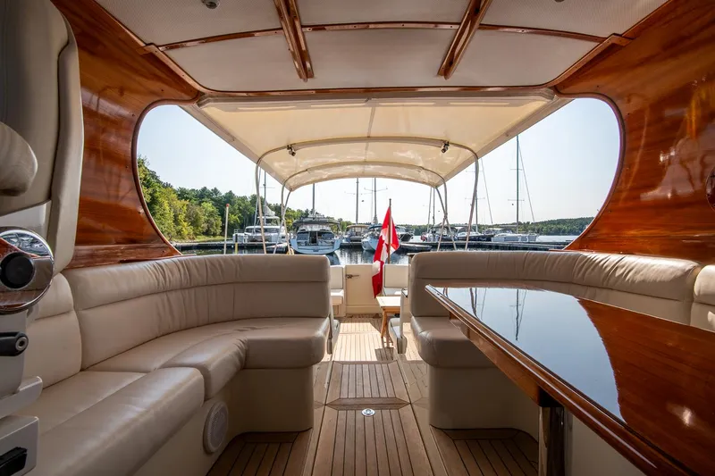 Slide: The Image of Luxurious interior of 2003 Hinckley Talaria 44 Express yacht with elegant seating and wood finish. - 23