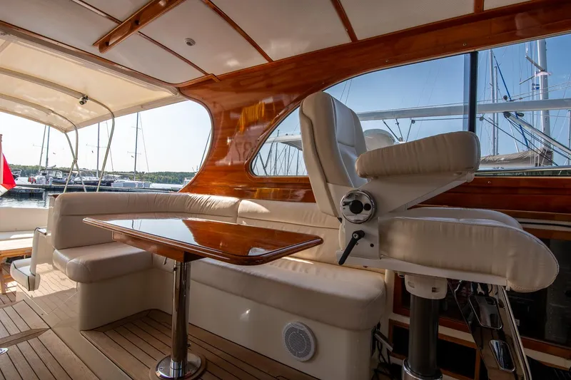 Slide: The Image of Luxurious interior of 2003 Hinckley Talaria 44 Express yacht with elegant seating and wooden accents. - 25