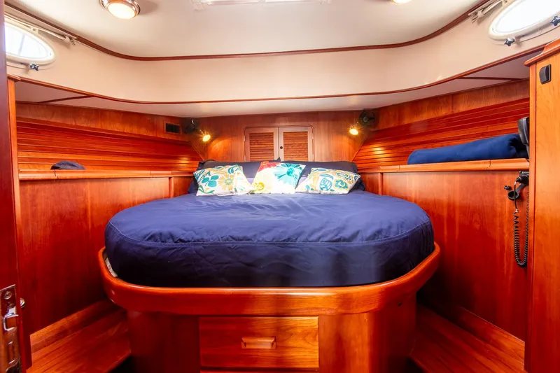 Slide: The Image of Luxurious cabin interior of 2003 Hinckley Talaria 44 Express yacht with wooden finish. - 35