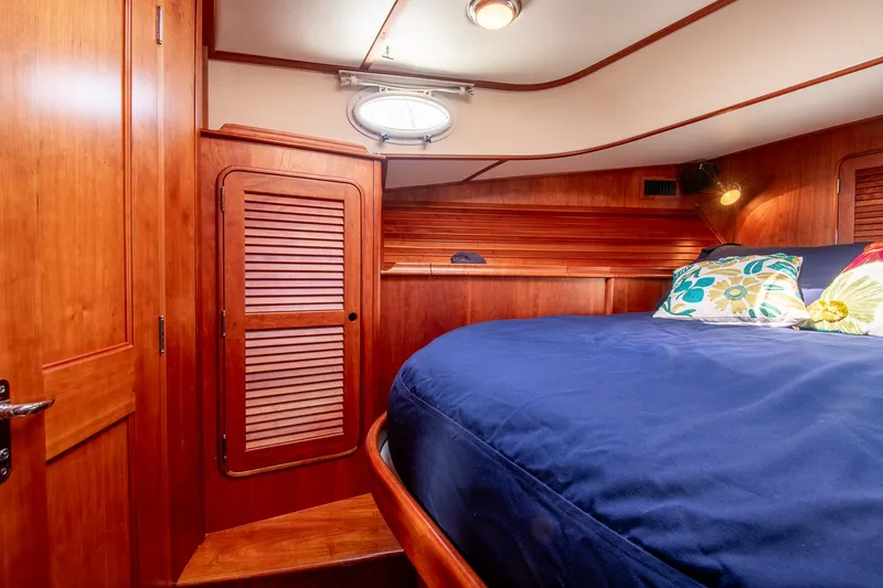 Slide: The Image of Luxurious cabin interior of 2003 Hinckley Talaria 44 Express yacht with wooden finish. - 37