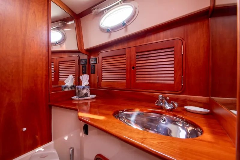 Slide: The Image of Luxurious wooden interior of 2003 Hinckley Talaria 44 Express yacht bathroom. - 38