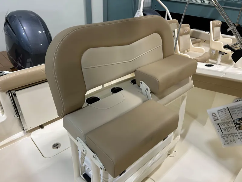 Slide: The Image of 2024 Scout 215 XSF boat interior with tan and cream seating. - 3