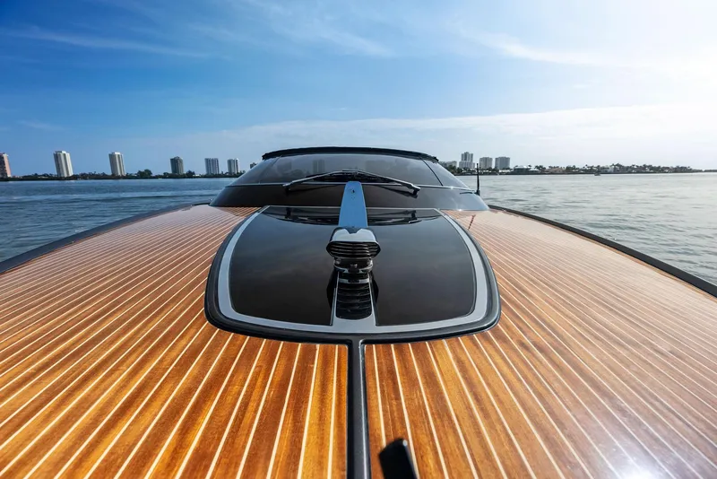 Slide: The Image of 2017 Riva Rivamare luxury yacht on calm waters with city skyline. - 11