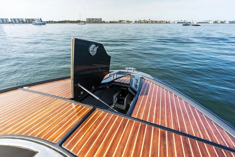 Slide: The Image of 2017 Riva Rivamare boat with wooden deck on calm water. - 12
