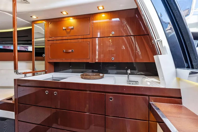 Slide: The Image of Luxurious wooden cabinetry in the 2017 Riva Rivamare yacht kitchen. - 24