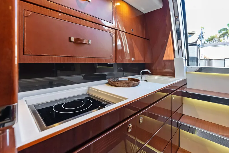 Slide: The Image of 2017 Riva Rivamare yacht kitchen with modern appliances and wooden cabinetry. - 26