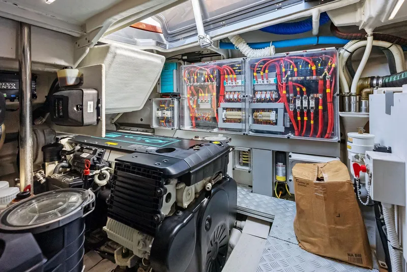 Slide: The Image of Engine room of a 2017 Riva Rivamare yacht with electrical panels and machinery. - 32