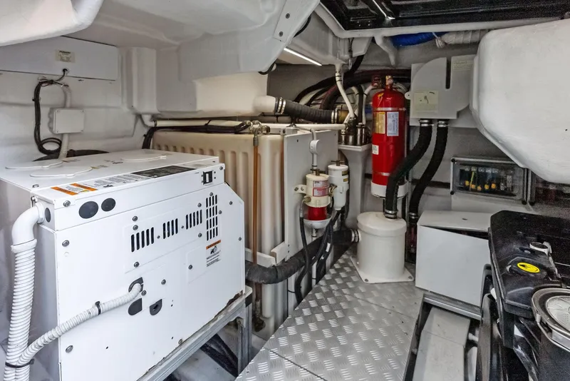 Slide: The Image of Engine room of a 2017 Riva Rivamare yacht with equipment and fire extinguisher. - 33