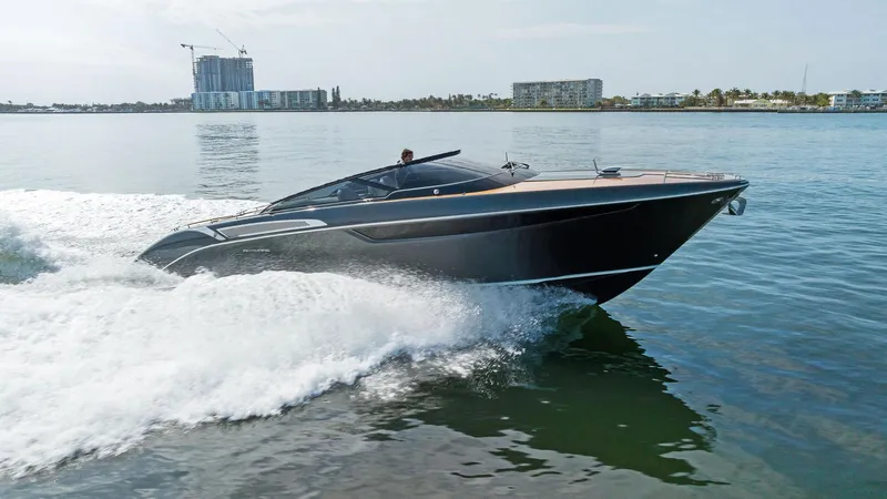 Slide: The Image of 2017 Riva Rivamare luxury speedboat cruising on calm waters. - 4