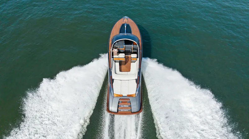 Slide: The Image of 2017 Riva Rivamare luxury speedboat cruising on open water. - 6