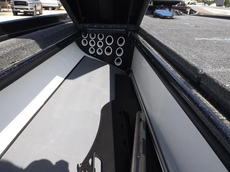 Slide: The Image of 2020 Falcon Boats 21TE interior storage compartment with rod holders. - 10