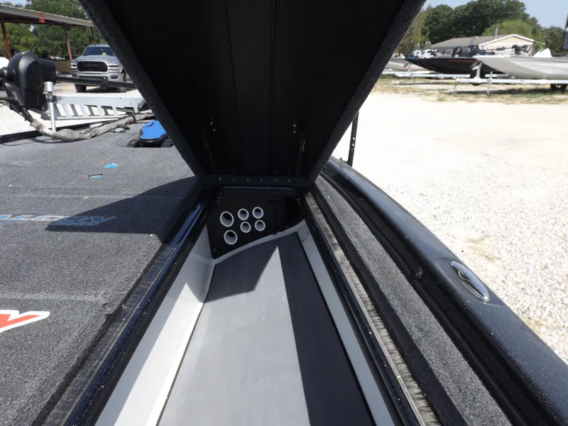 Slide: The Image of 2020 Falcon Boats 21TE storage compartment with open lid. - 11
