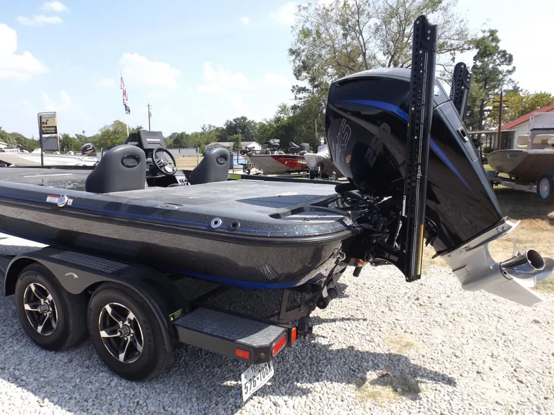 Slide: The Image of 2020 Falcon Boats 21TE on trailer, rear view with outboard motor. - 13