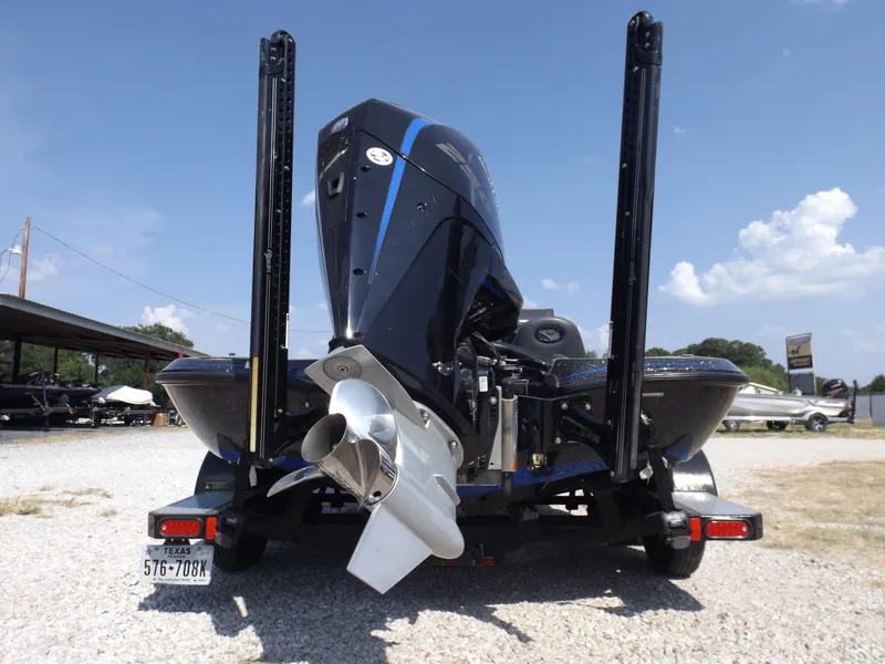 Slide: The Image of 2020 Falcon Boats 21TE rear view with outboard motor and trailer. - 16