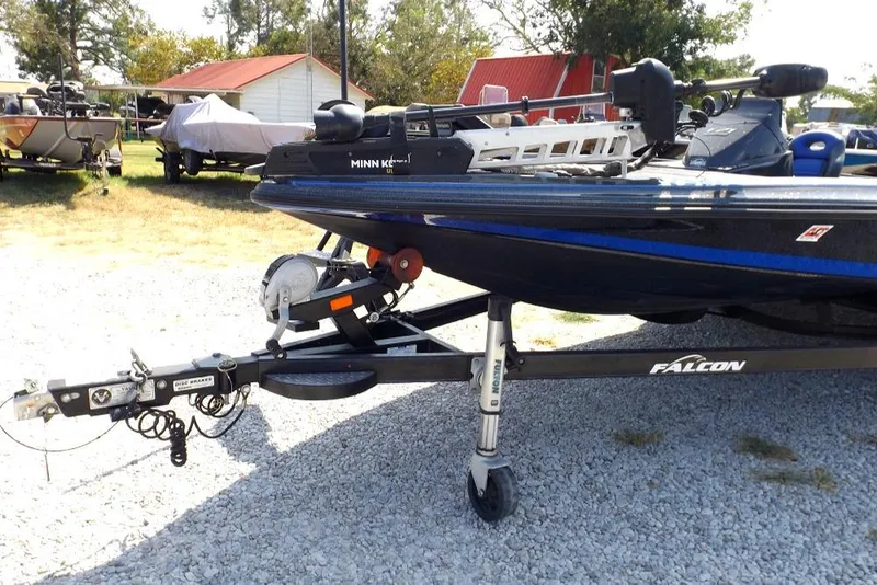 Slide: The Image of 2020 Falcon Boats 21TE on trailer with Minn Kota trolling motor. - 19