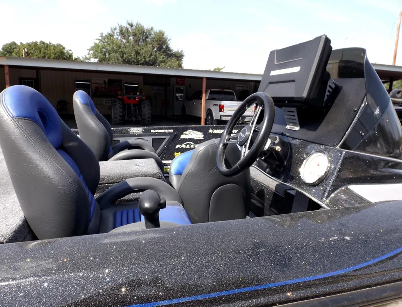 Slide: The Image of 2020 Falcon Boats 21TE interior with steering wheel and seats. - 22