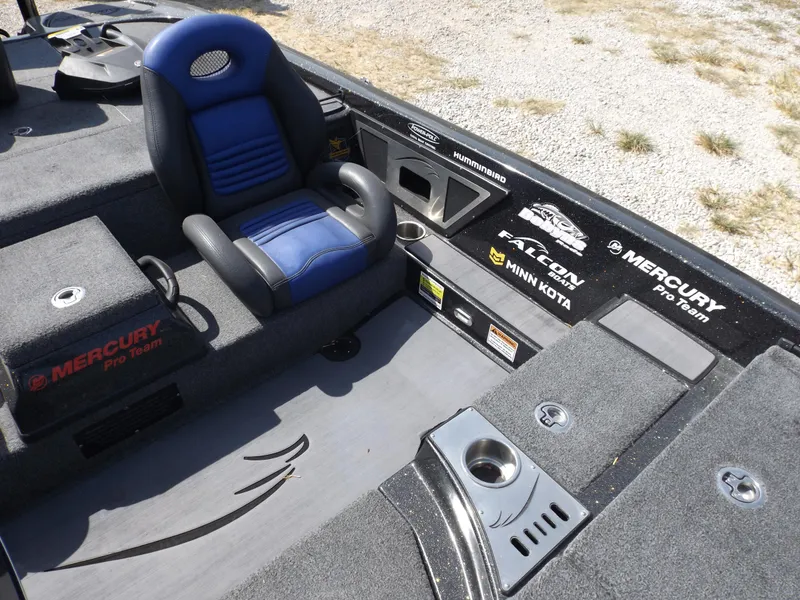 Slide: The Image of 2020 Falcon Boats 21TE interior with blue seat and Mercury Pro Team branding. - 6