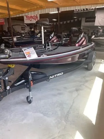 Slide: The Image of 2024 Nitro Z18 fishing boat displayed in a showroom. - 1
