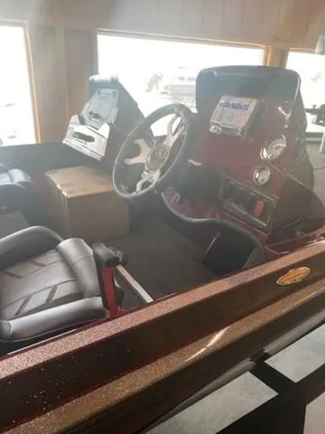 Slide: The Image of 2024 Nitro Z18 boat interior with steering wheel and dashboard. - 12