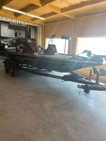 Slide: The Image of 2024 Nitro Z18 boat in showroom, side view. - 7