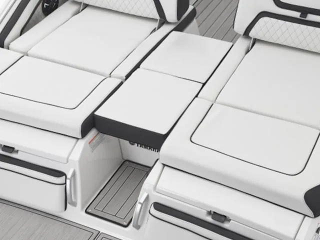 Slide: The Image of 2024 Yamaha Boats 275SD interior seating with white cushions and sleek design. - 3