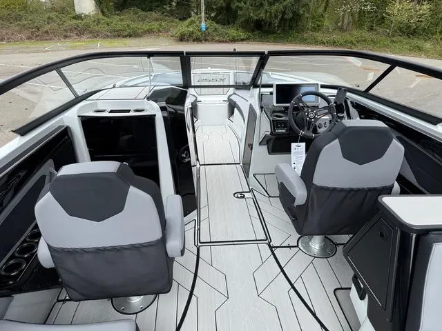 Slide: The Image of 2024 Yamaha Boats 255XE interior with modern dashboard and seating. - 10