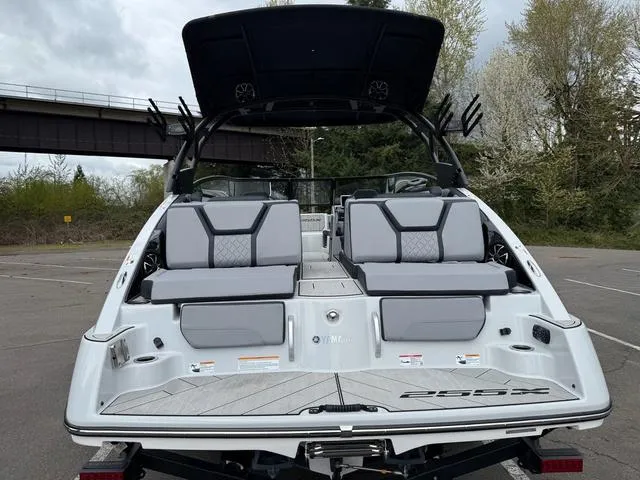 Slide: The Image of 2024 Yamaha Boats 255XE, rear view, showcasing seating and sleek design. - 12