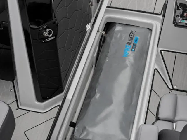 Slide: The Image of 2024 Yamaha Boats 255XE interior storage compartment with Wake Makers ballast bag. - 13