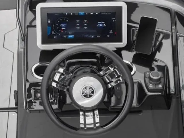 Slide: The Image of 2024 Yamaha Boats 255XE dashboard with touchscreen display and steering wheel. - 4