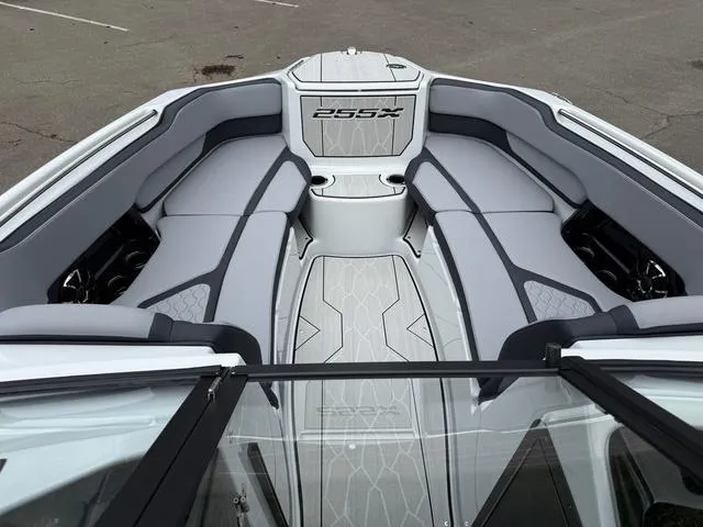 Slide: The Image of 2024 Yamaha Boats 255XE interior with sleek gray seating and modern design. - 9