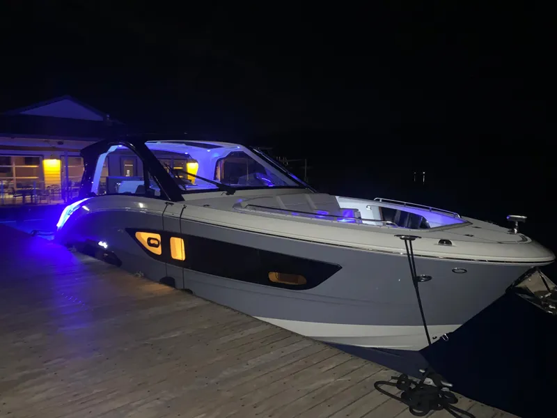 Slide: The Image of 2025 Sea Ray Sundancer 370 OB yacht on a trailer in a warehouse. - 23