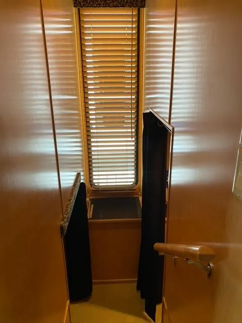 Slide: The Image of Interior of 2006 Sumerset Houseboat with wooden blinds and stairway. - 13