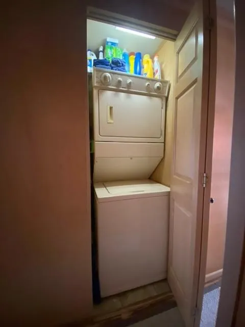 Slide: The Image of Compact laundry area with stacked washer and dryer in a 2006 Sumerset Houseboat. - 15