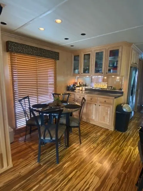 Slide: The Image of 2006 Sumerset Houseboat interior with dining area and kitchen. - 4