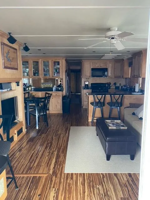 Slide: The Image of Interior of a 2006 Sumerset Houseboat with modern kitchen and living area. - 6