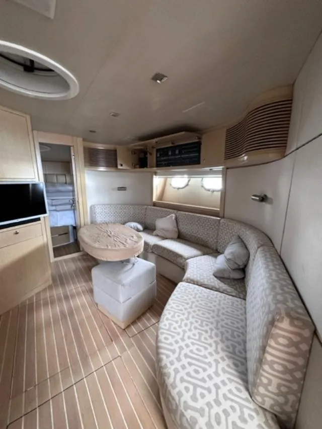 Slide: The Image of Luxurious interior of a 2006 Baia 63 Azzurra yacht with elegant seating and modern amenities. - 13